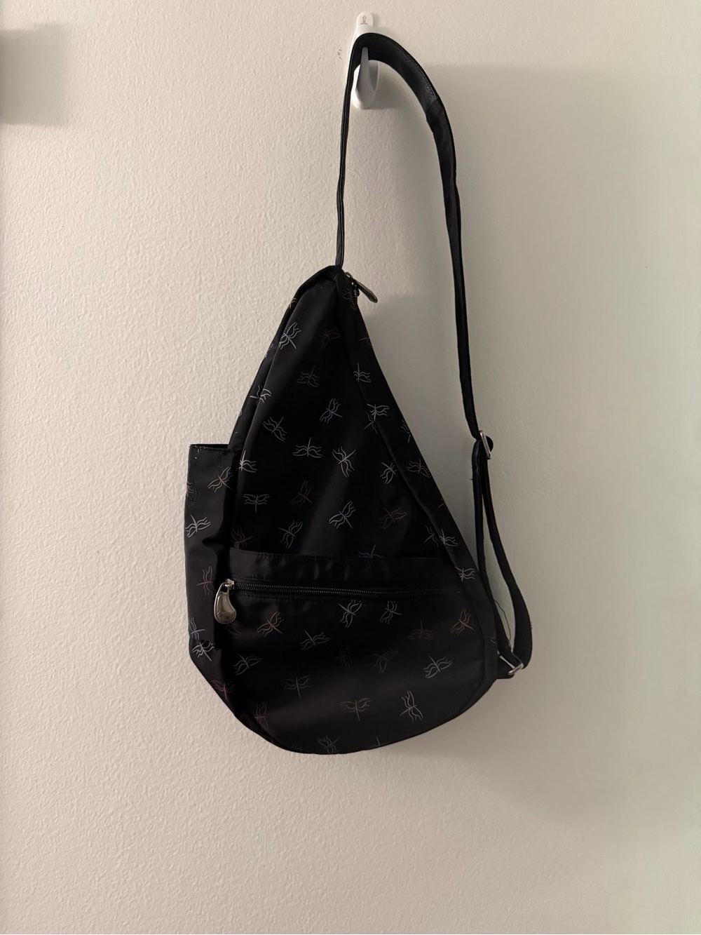 Ameribag Black Sling Crossbody with fireflies on it